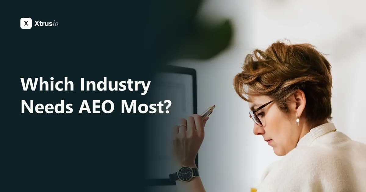 Professional reviewing documents beside a computer, illustrative photograph for which industry needs AEO most
