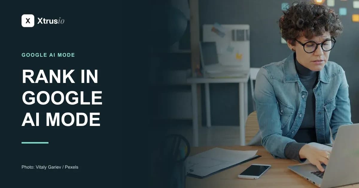 A focused professional working on a laptop beside the headline Rank in Google AI Mode